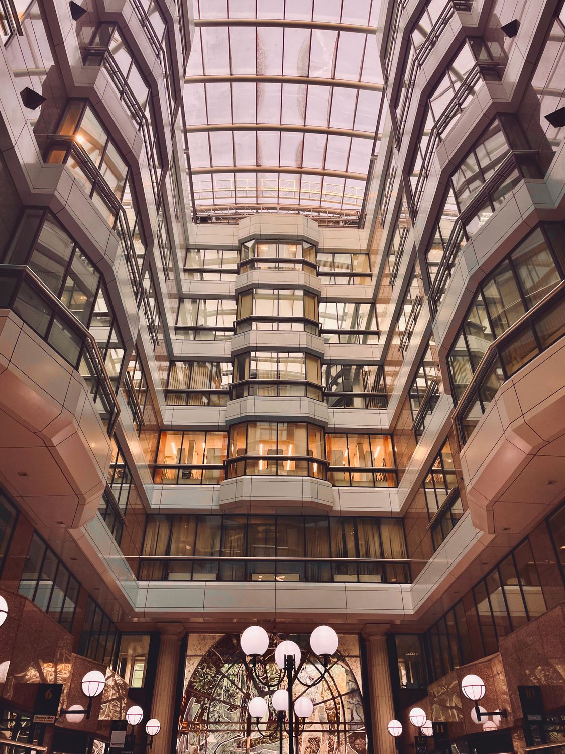 Atrium Modern Innovative Modern Atrium with Glass Ceiling and Warm Lighting · Free Stock Photo