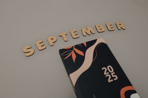 Free Stylized September typography with abstract 2025 calendar cover. Stock Photo