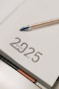 Elegant 2025 Agenda Book with Pen on Desk