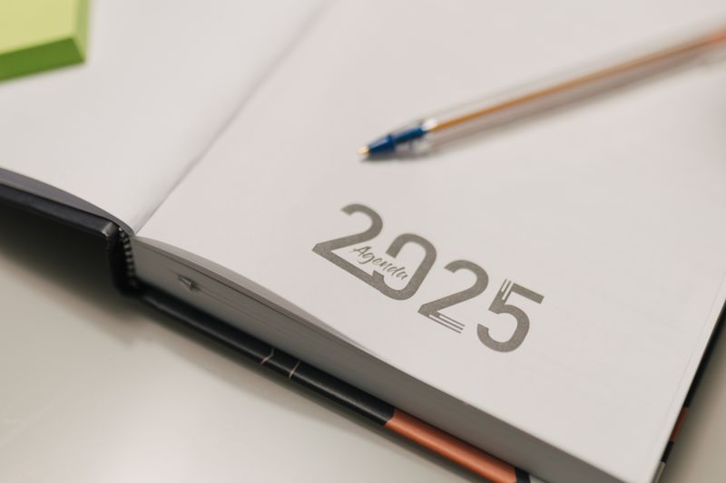 Agenda planner with pen on desk