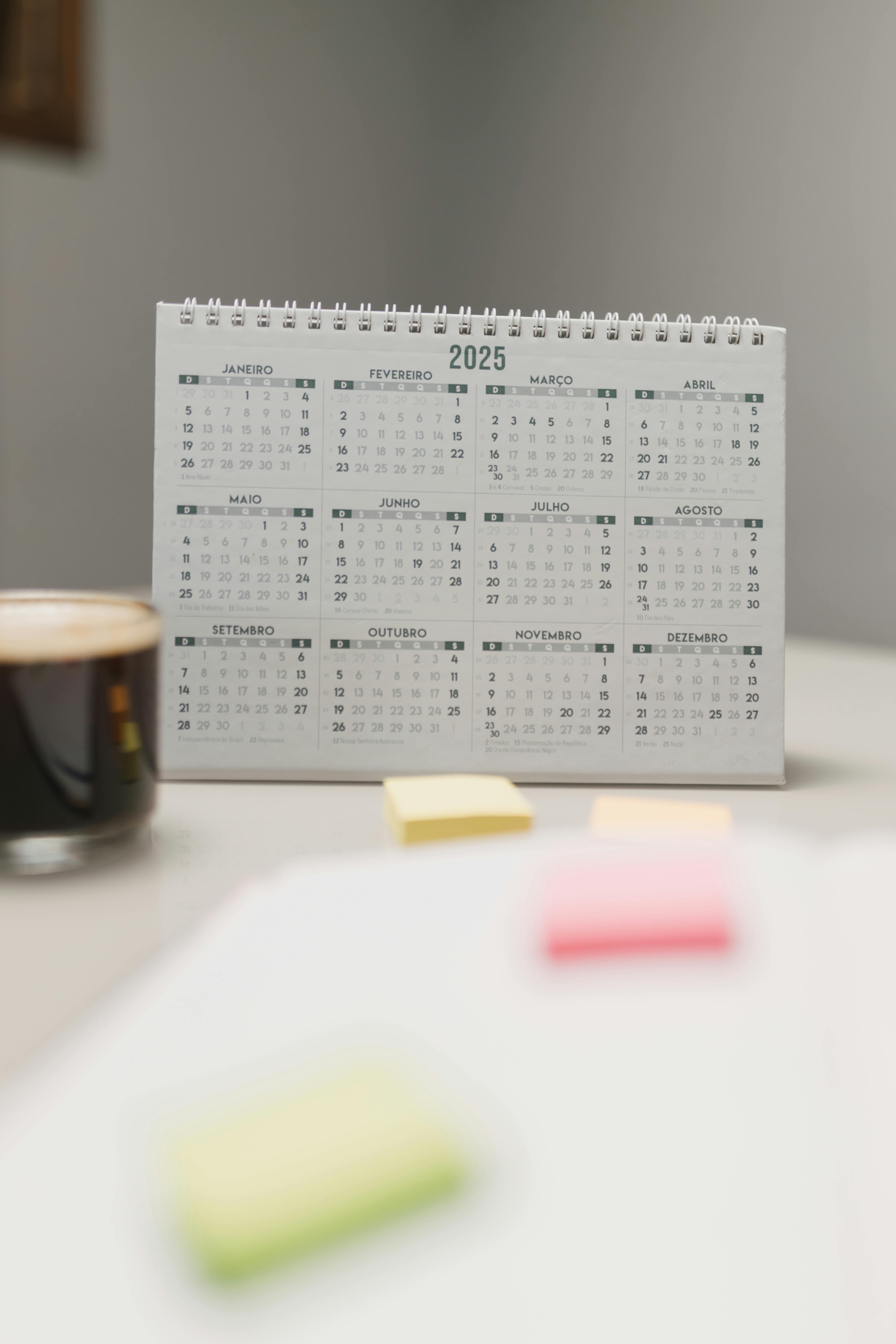 2025 desk calendar with coffee and notepads