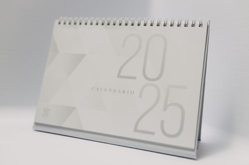 Free Minimalist 2025 desk calendar with a modern design, perfect for planning and organizing your year. Stock Photo