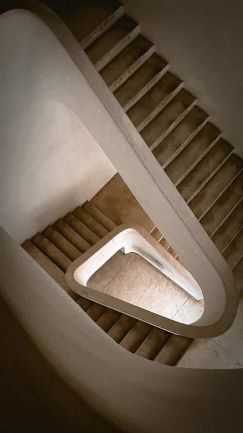 Free Artistic view of a modern spiral staircase in Lisbon, Portugal, showcasing architectural elegance. Stock Photo