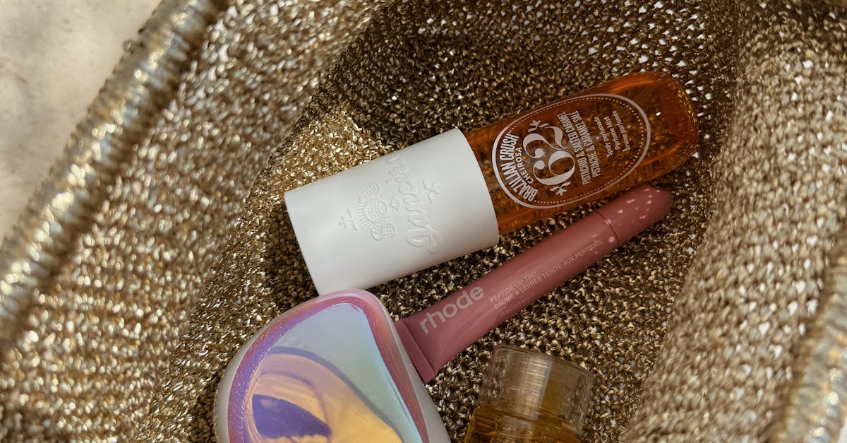 a woman applying sunscreen to her face on a sunny beach