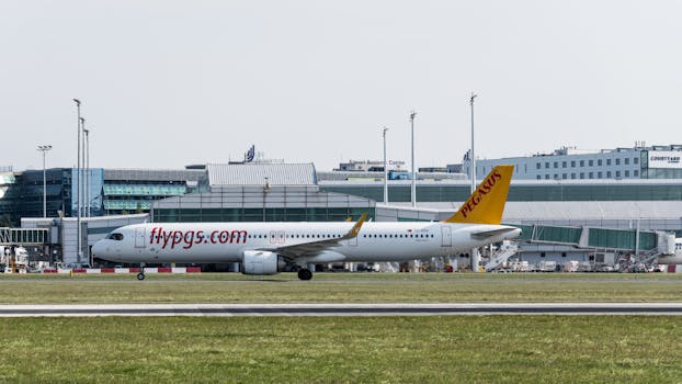 A Pegasus Airlines jet taxiing on the runway at Prague Airport, Czech Republic.