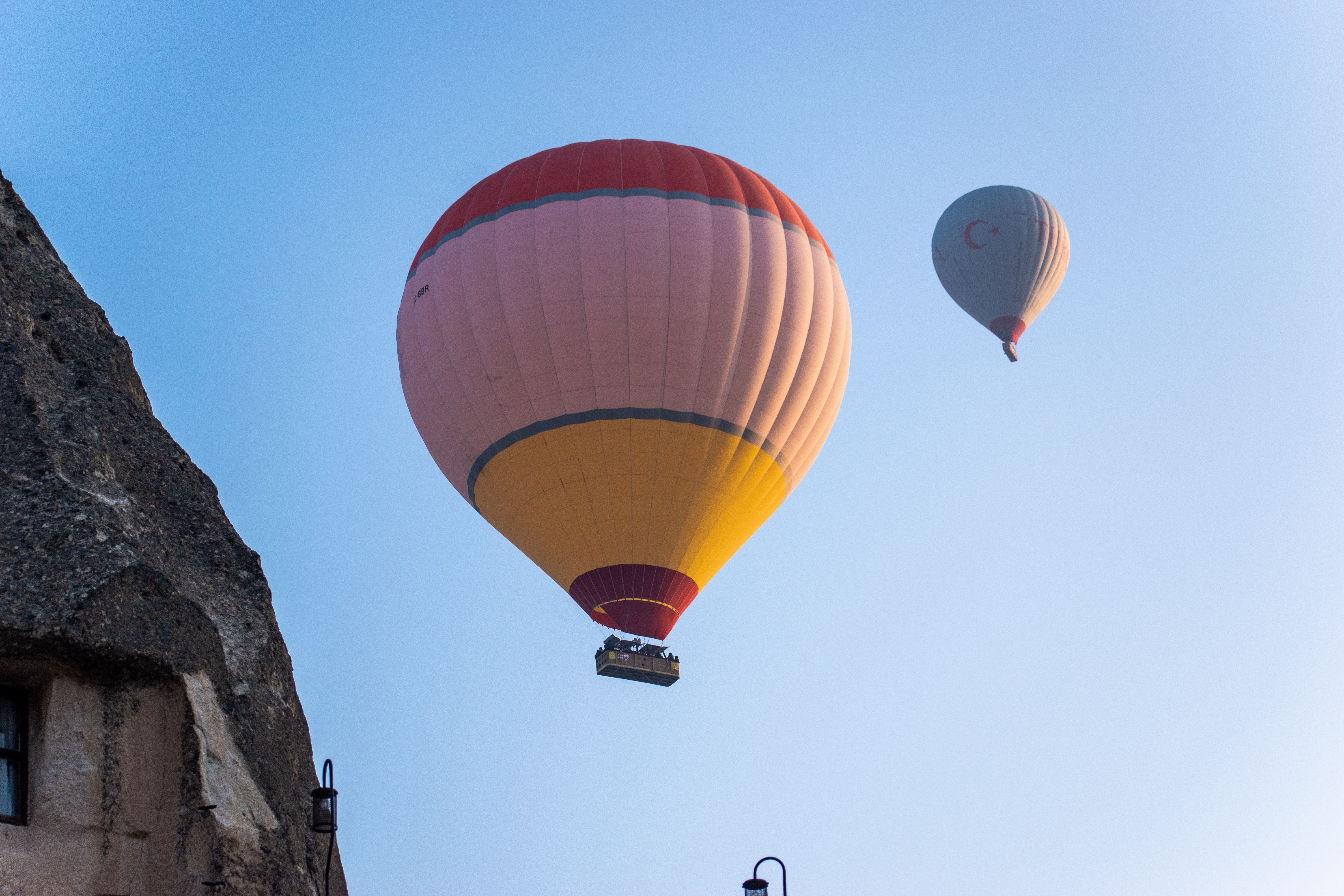 Hot air balloons soaring over the unique rock formations of Cappadocia, Turkey