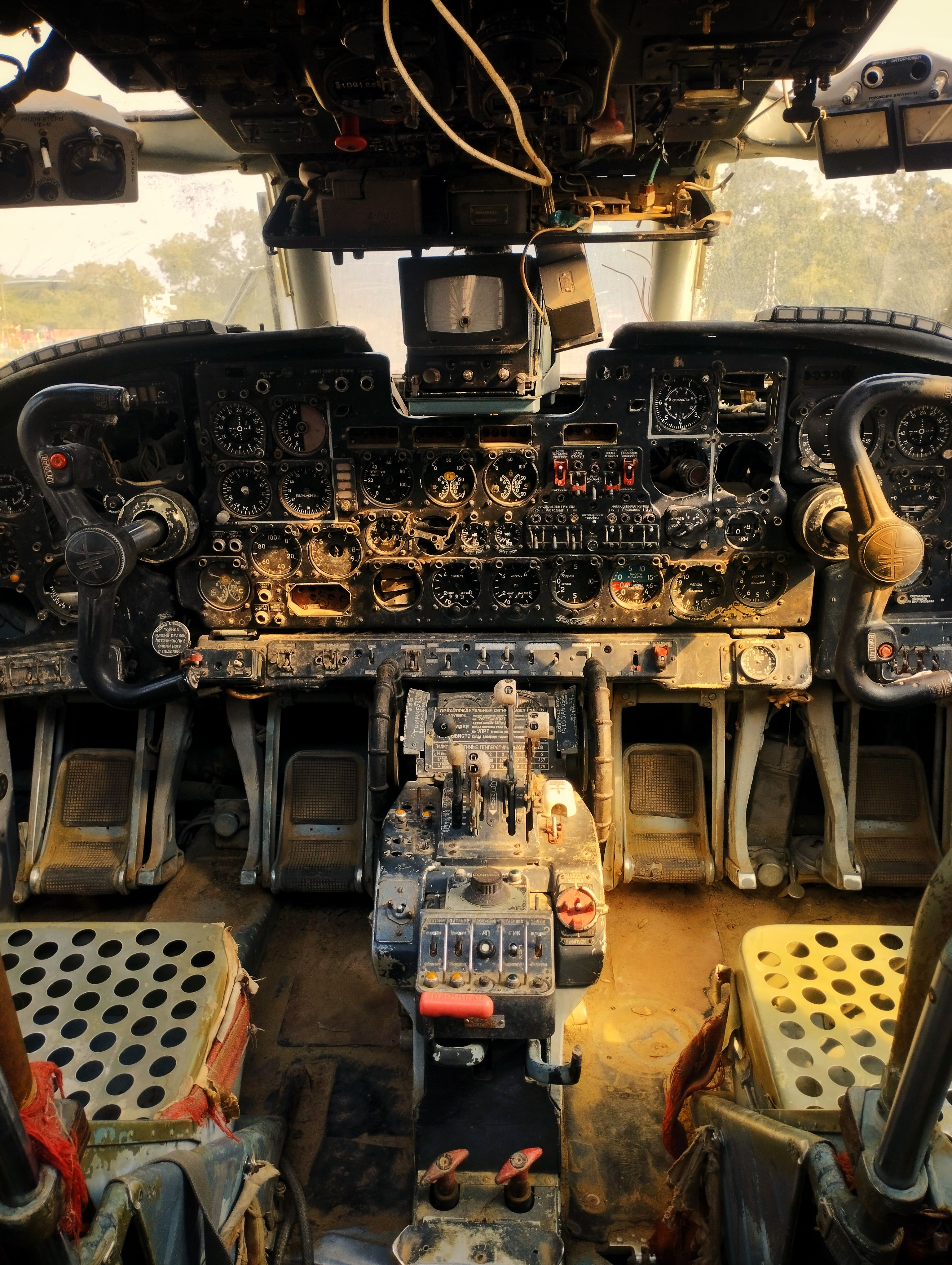Explore a vintage airplane cockpit with rusted controls, offering a nostalgic glimpse into aviation history.