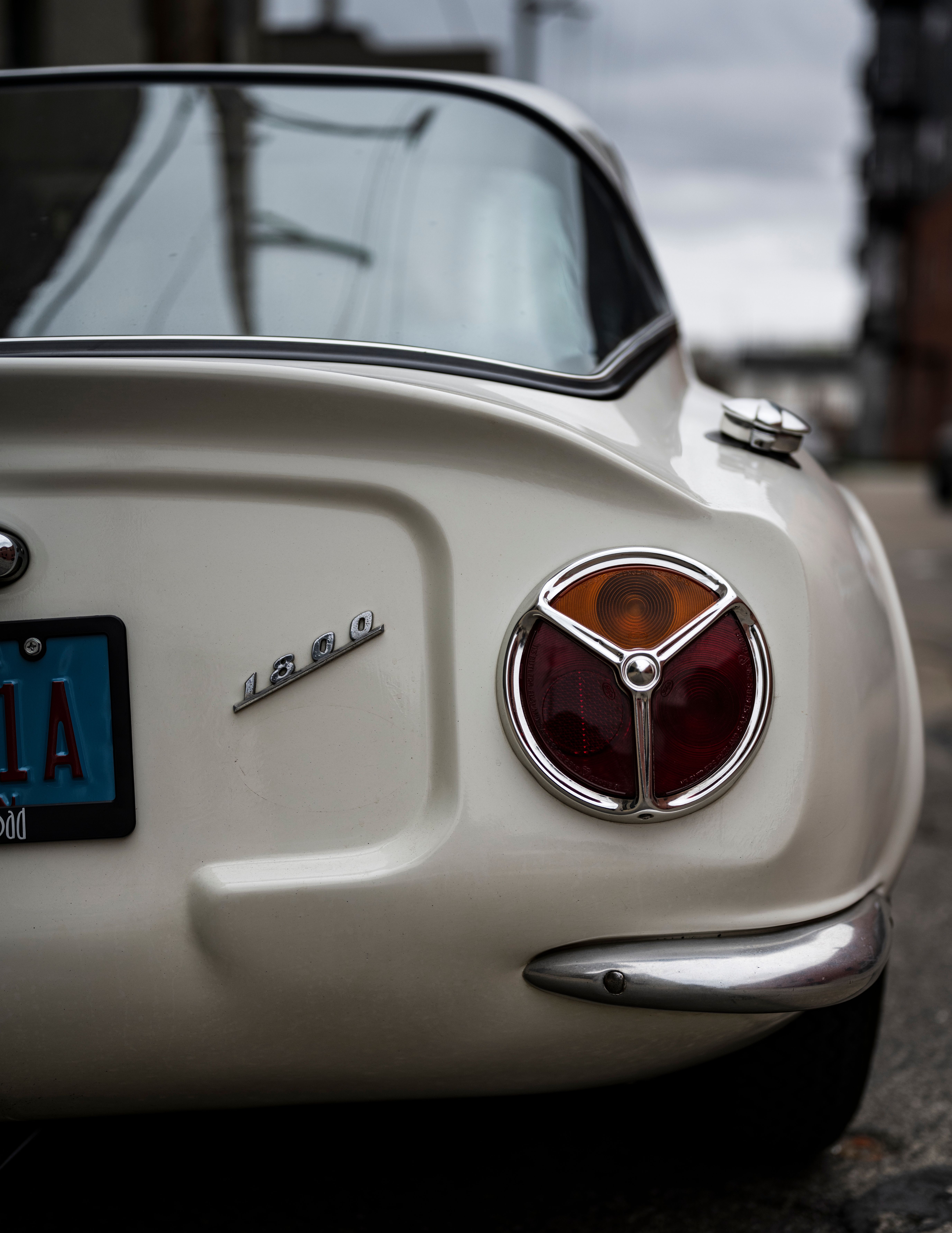 Vintage White Car Rear View in Urban Setting · Free Stock Photo