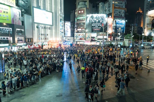 A lively crowd gathers in Ximending at night, showcasing Taipei's vibrant urban life.