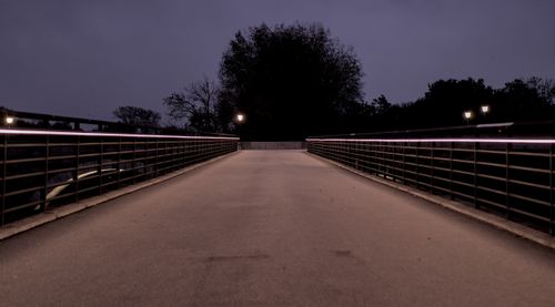 Free Peaceful pedestrian bridge in Regensburg at night with ambient street lamps. Stock Photo
