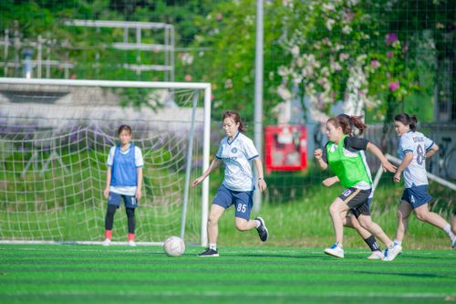 Free Action shot of women playing soccer on a sunny day in Hà Nội, Vietnam. Stock Photo