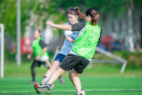 Free Intense soccer match between women in Hà Nội, Vietnam captured in action. Stock Photo