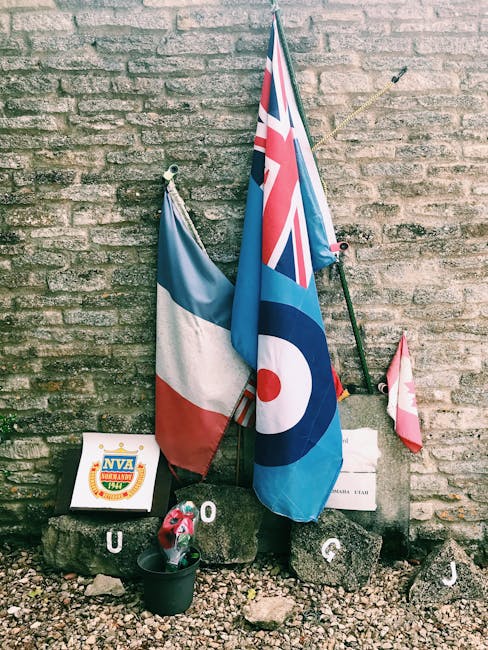 Flags and memorial stones honoring the Royal Air Force in Kemble, England.