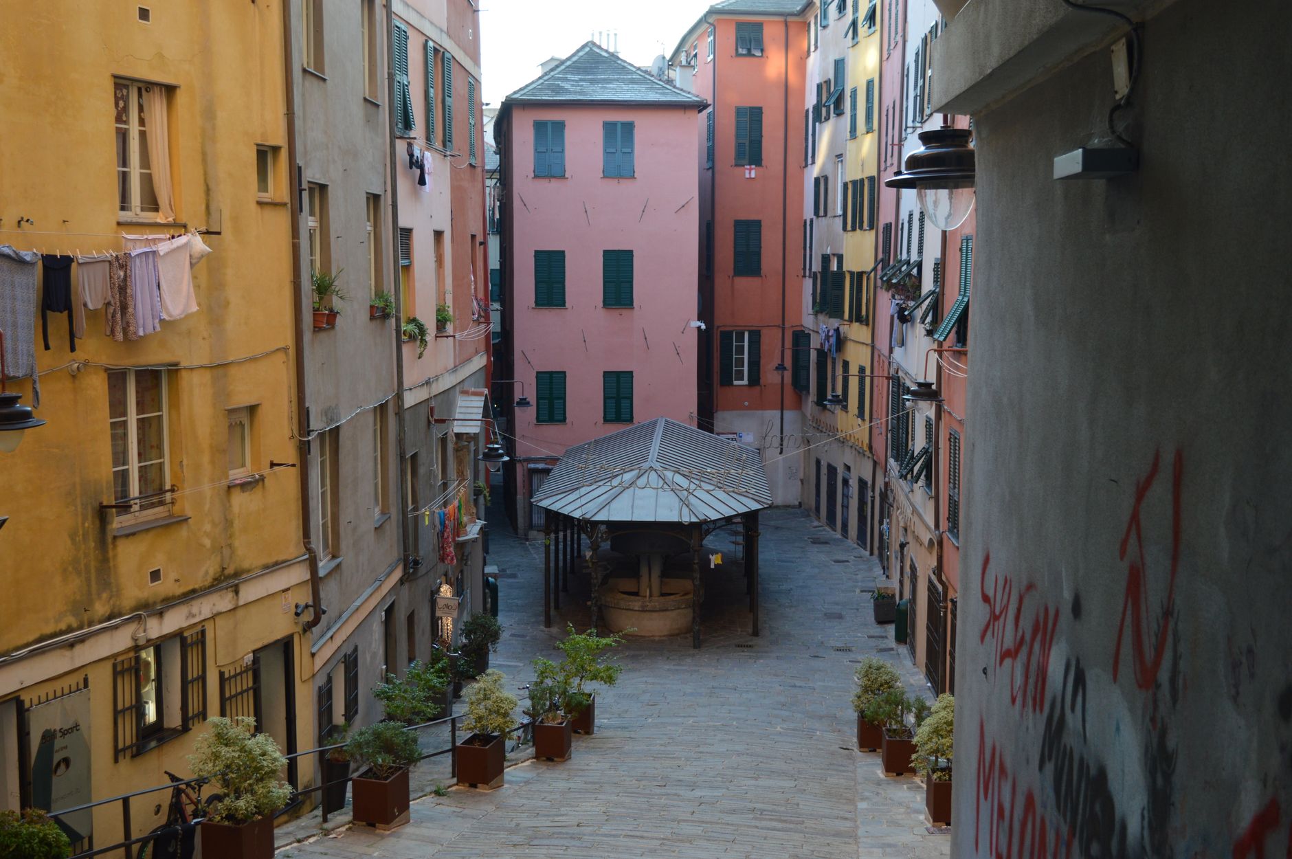 A narrow caruggio alley in Genoa's old town