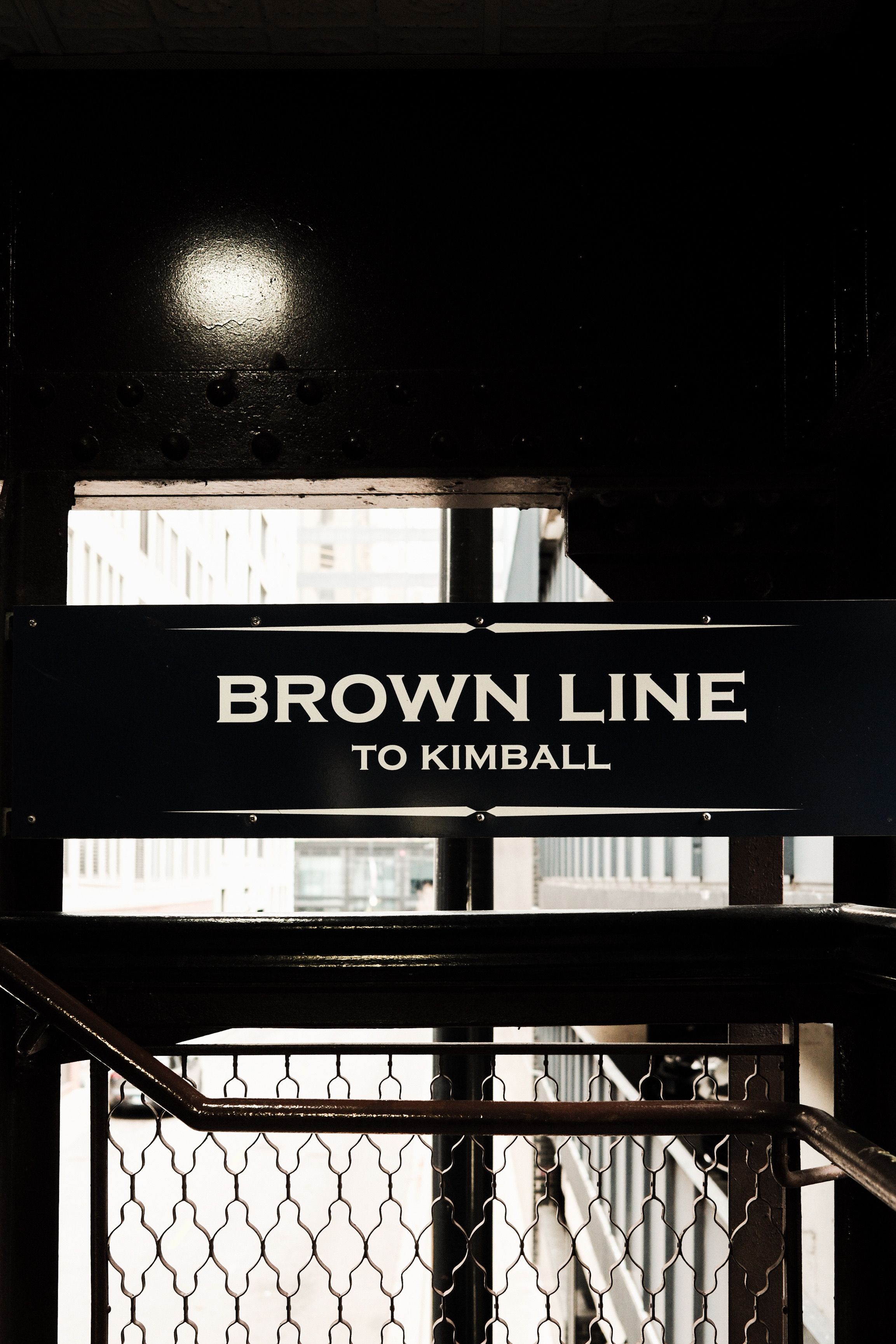 Close-up of the Brown Line sign at a Chicago subway station heading to Kimball.