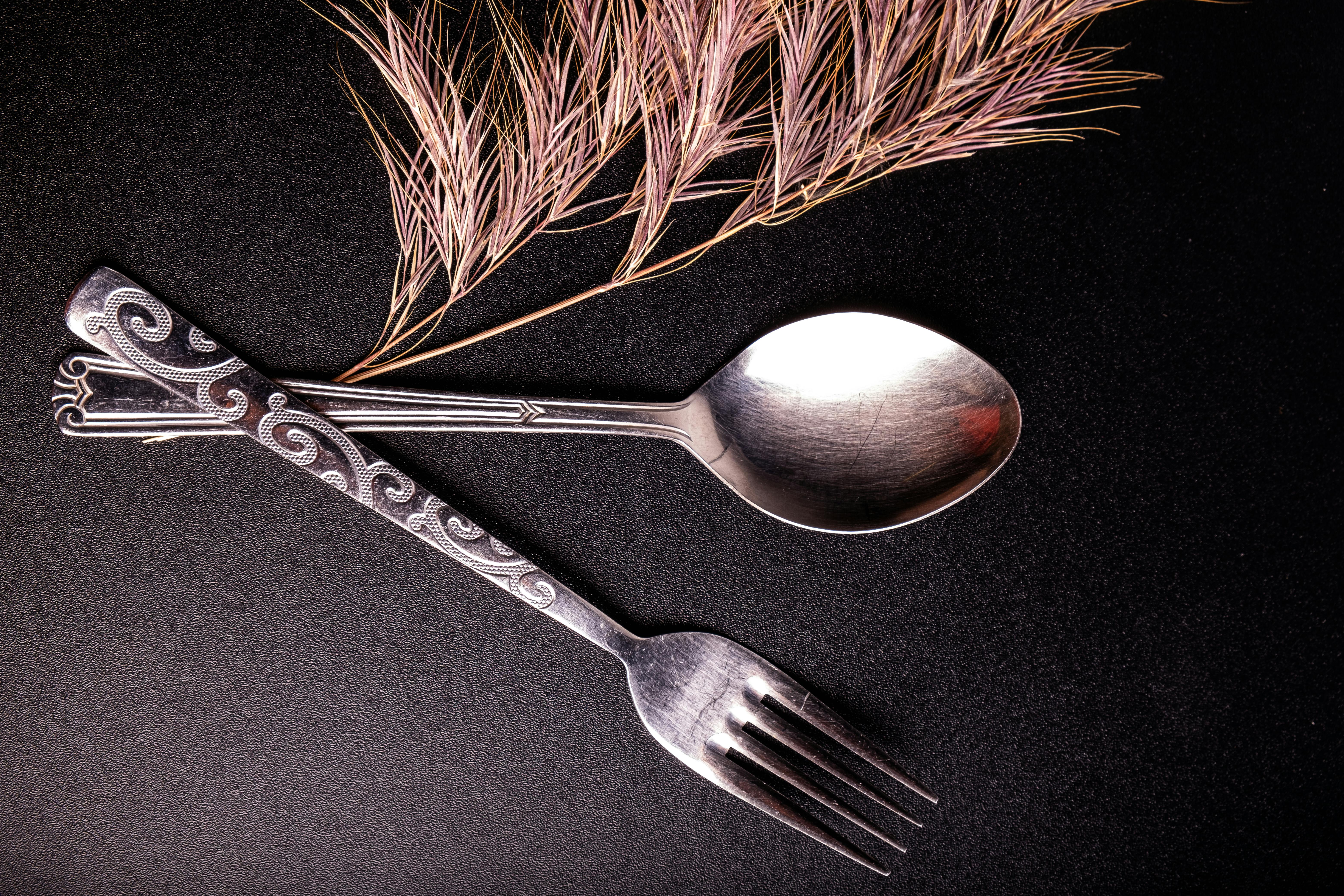 Elegant Silverware with Ornamental Design · Free Stock Photo, image size:1125x750