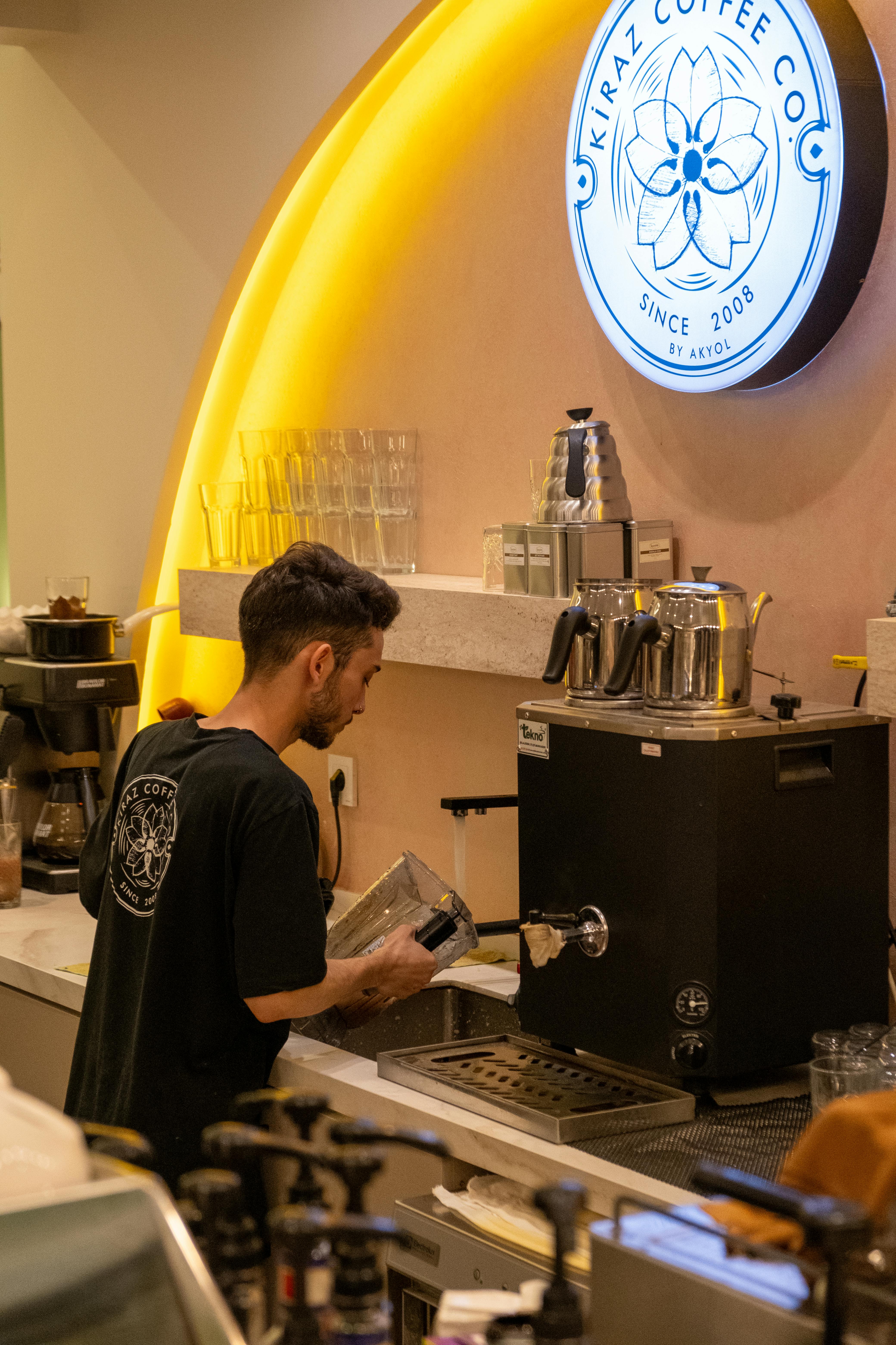 barista preparing coffee at modern cafe