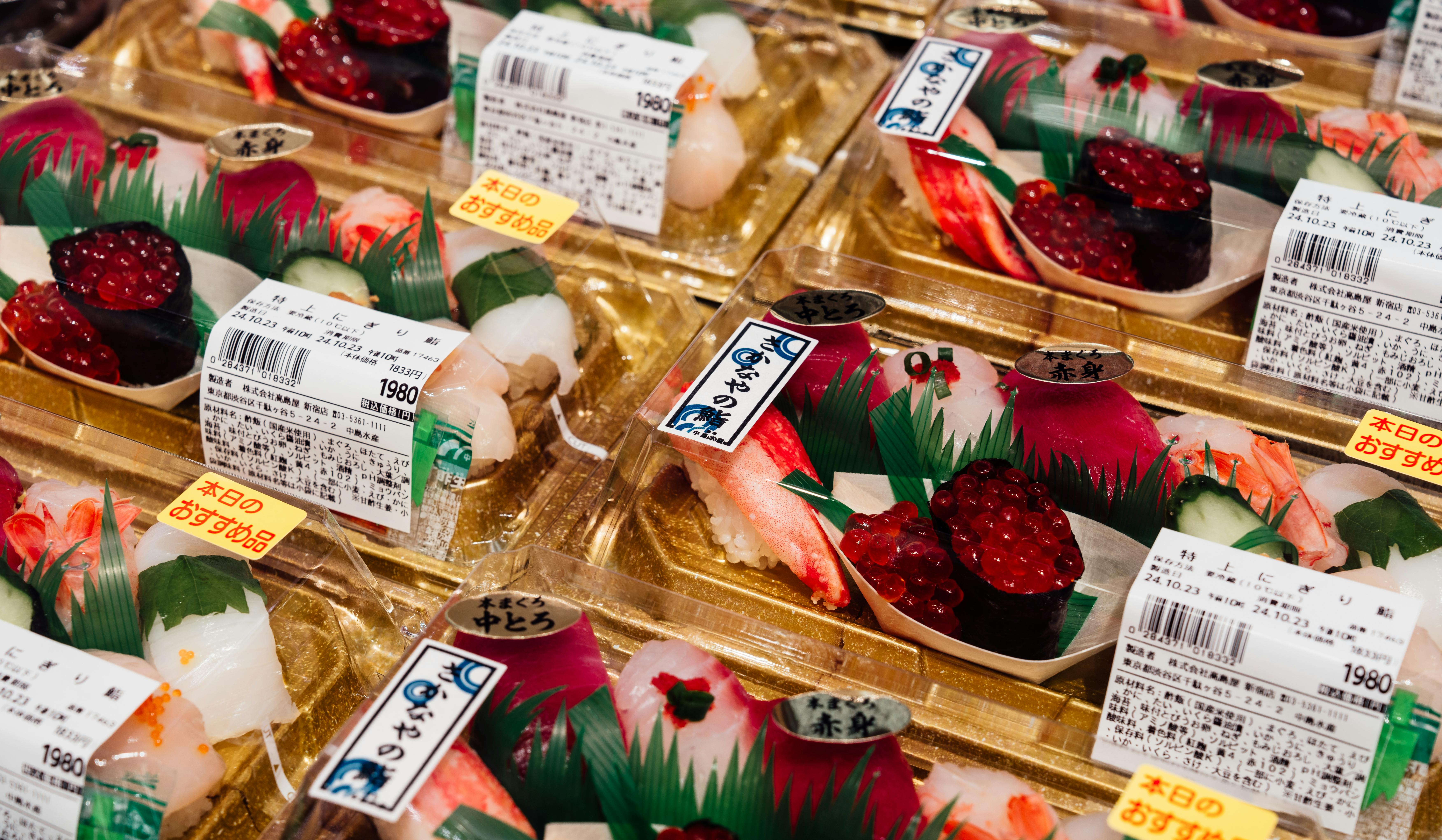 Fresh sushi in traditional Japanese packaging