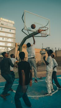 Dynamic street basketball scene with young men playing in Hargeisa, Somalia.