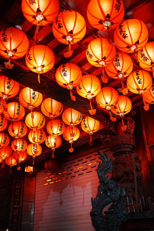 Free Vibrant red lanterns illuminate a traditional Taiwanese temple in New Taipei City. Stock Photo