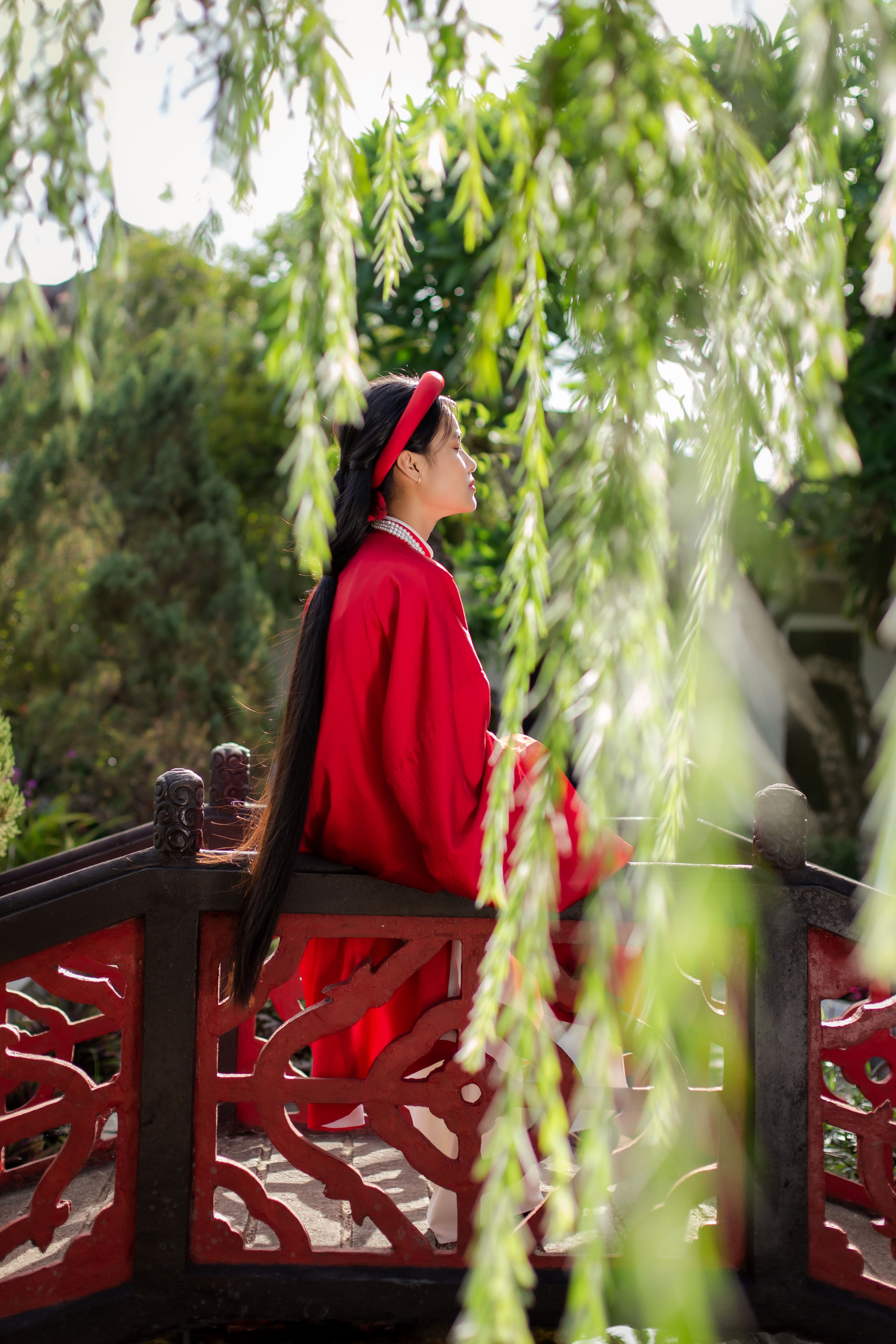 Woman in Red Dress on Bridge in Hoi An Garden · Free Stock Photo