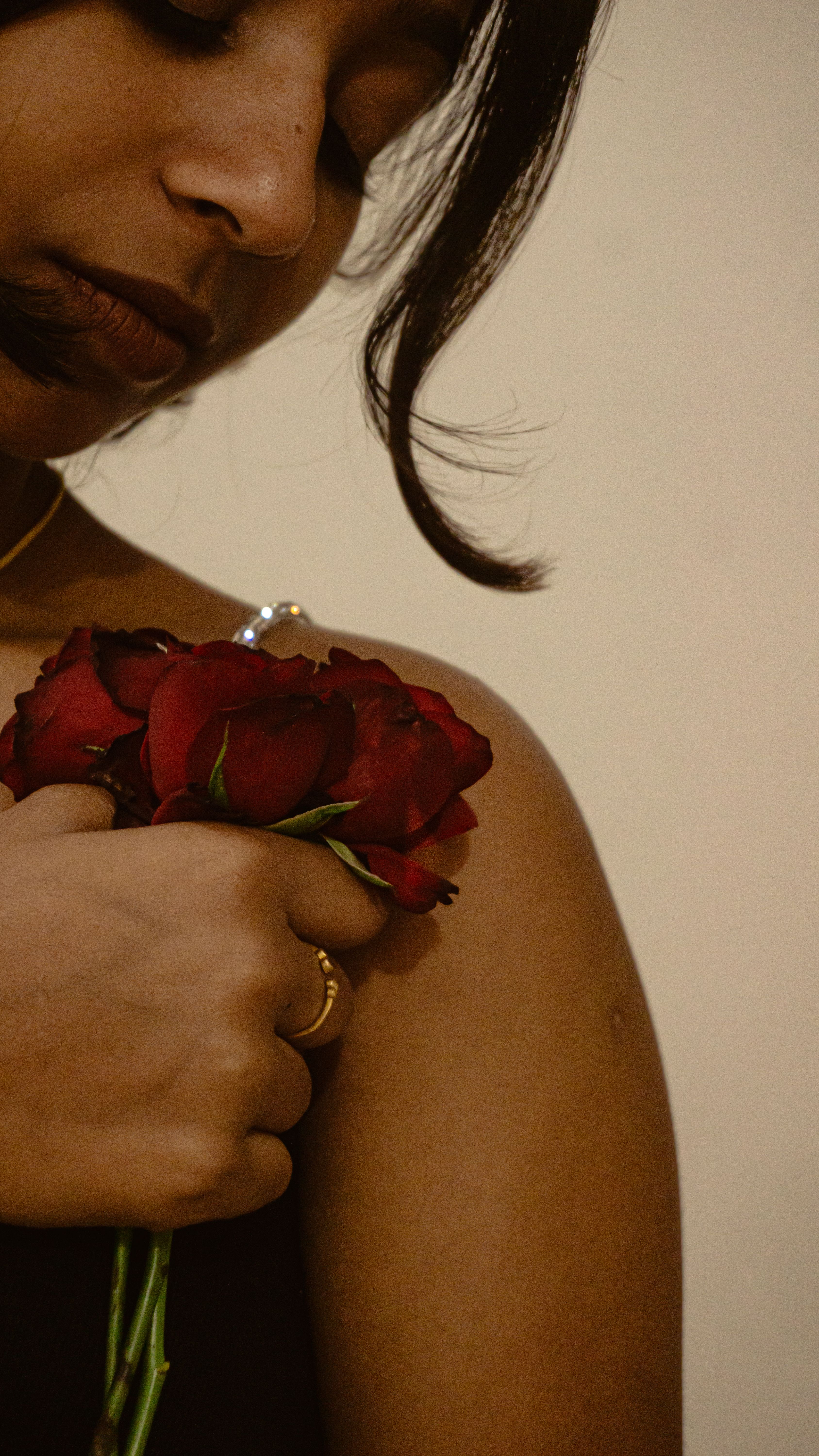 Elegant Portrait of Woman Holding Red Roses · Free Stock Photo