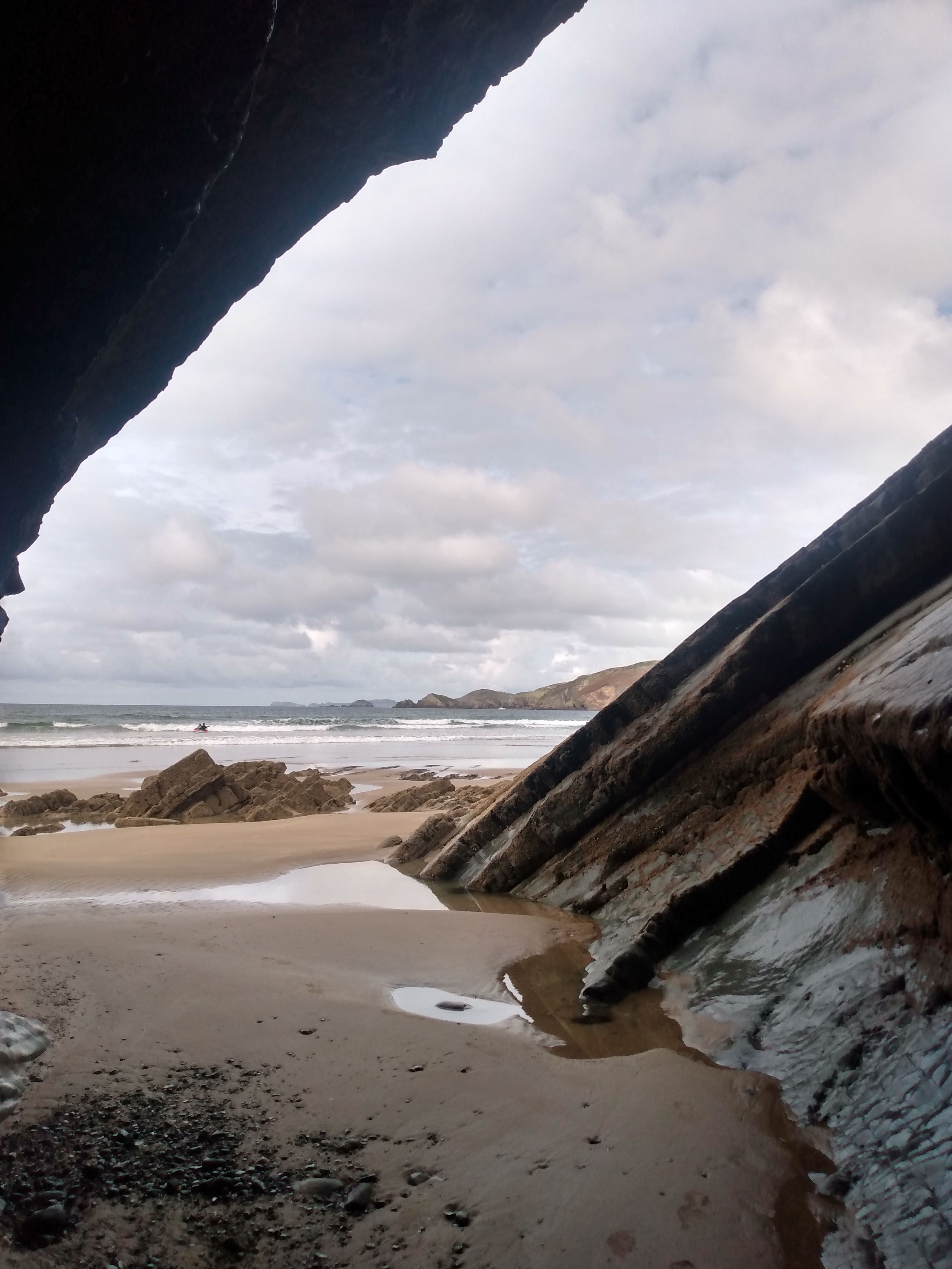 Scenic Beach View Through Rocky Cave Opening · Free Stock Photo
