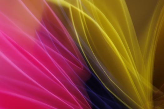 Colorful abstract light trails creating a vibrant, dynamic pattern.
