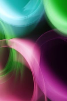 Vivid abstract blurred lights creating a colorful bokeh effect with a dreamy feel.
