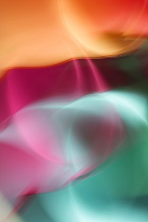 Free Colorful abstract image with dynamic light patterns in red, orange, and teal hues. Stock Photo