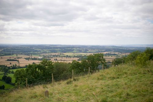 Free Idyllic countryside landscape in Wotton-under-Edge, England with rolling fields and greenery. Stock Photo