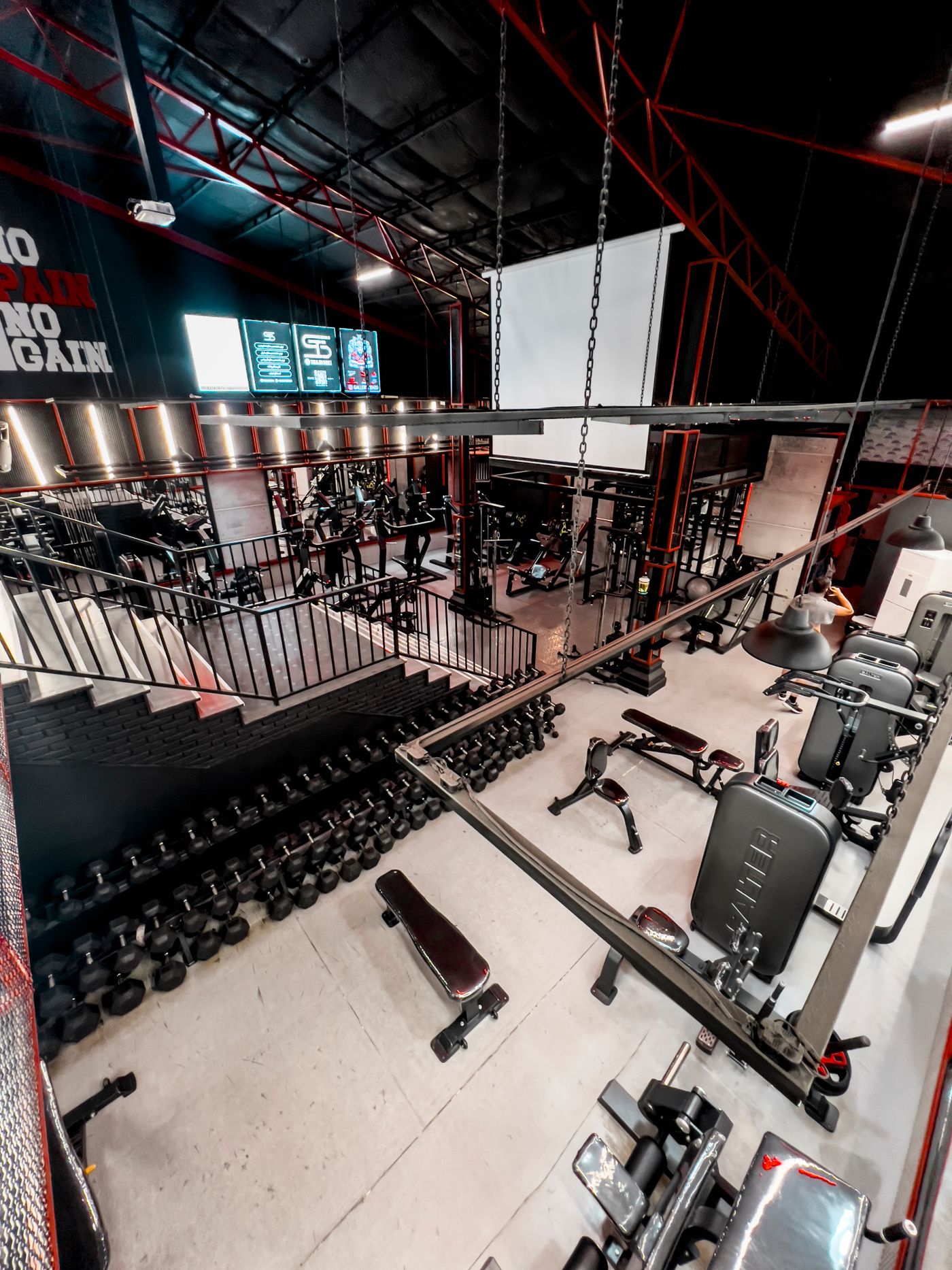 Spacious gym interior with a variety of fitness equipment