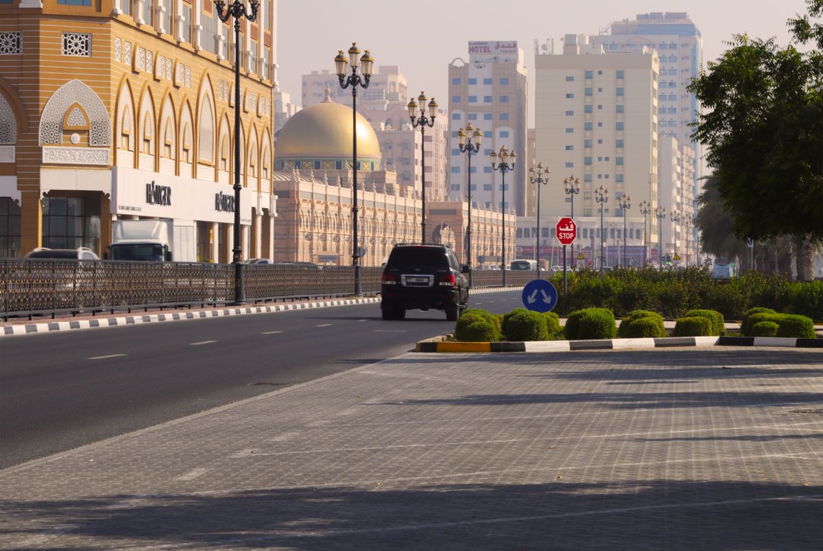 WhatsApp is where your Sharjah customers are Street scene with modern buildings in Sharjah
