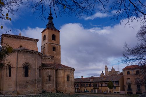 Free A beautiful historic church in Segovia, Spain under a cloudy sky with scenic surroundings. Stock Photo
