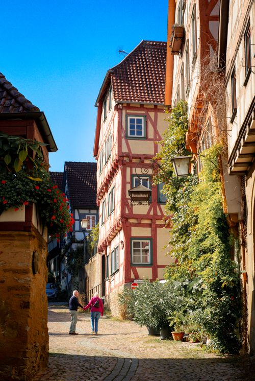 Free A picturesque view of a couple walking in historic Bad Wimpfen, Germany. Stock Photo