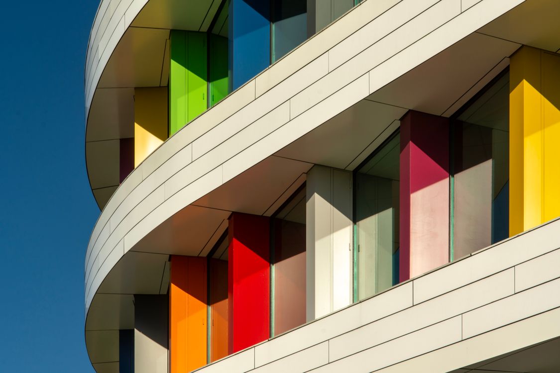 Building Design Patterns Colorful Modern Building Facade with Geometric Patterns · Free Stock Photo