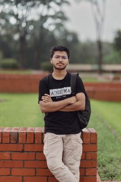 Student with glasses standing outdoors, photo by Sayeed Chowdhury on Pexels