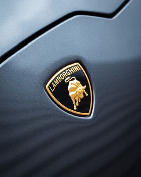 Detailed image of Lamborghini logo on car hood, showcasing luxury and design. 29527914