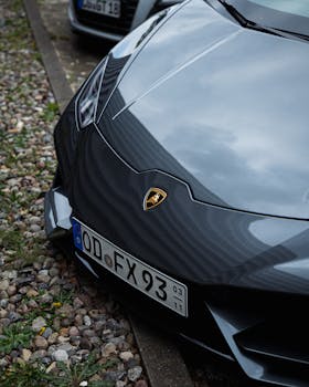 Close-up of a Lamborghini Huracan parked outdoors with license plate visible.