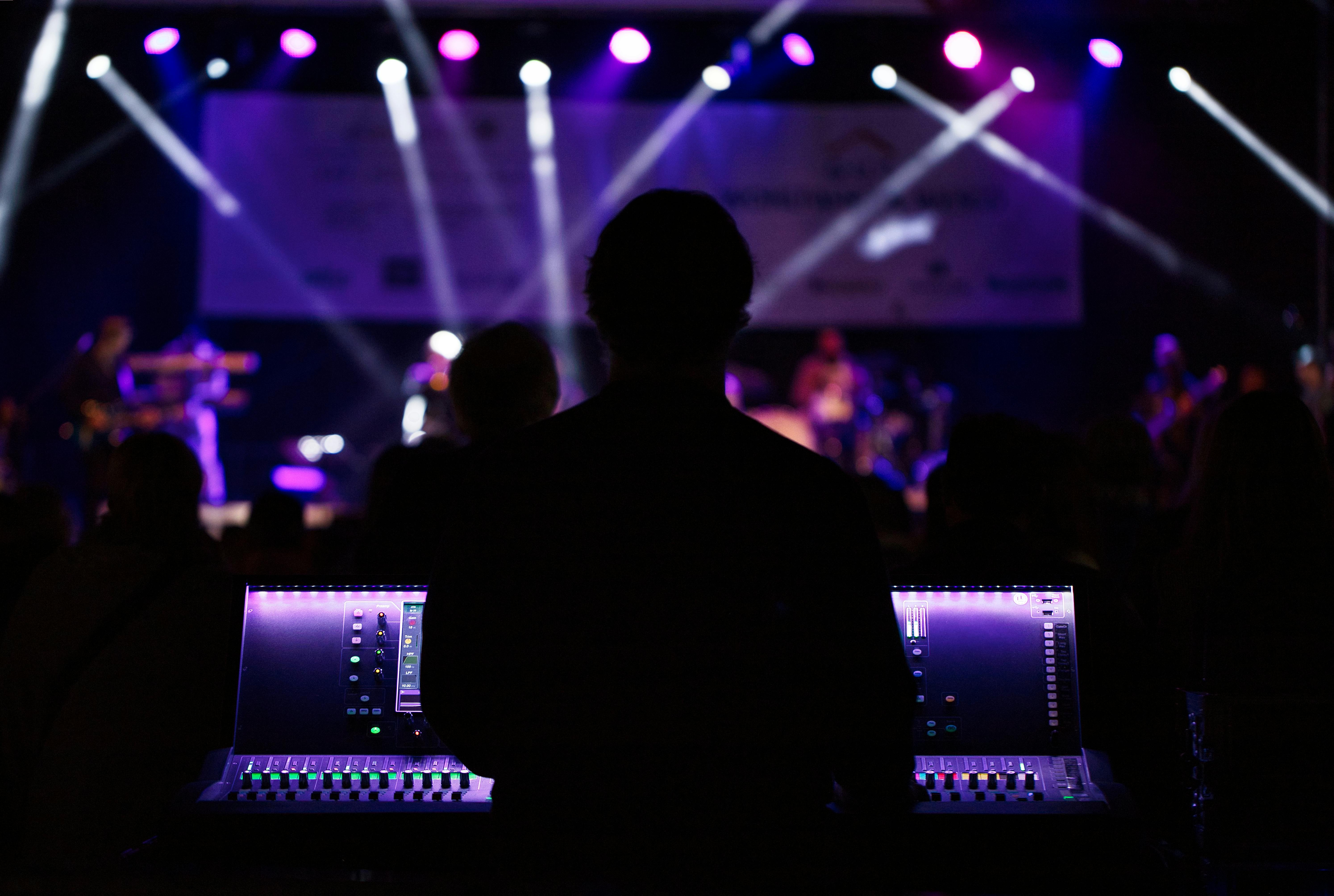 silhouette photo of people beside monitor