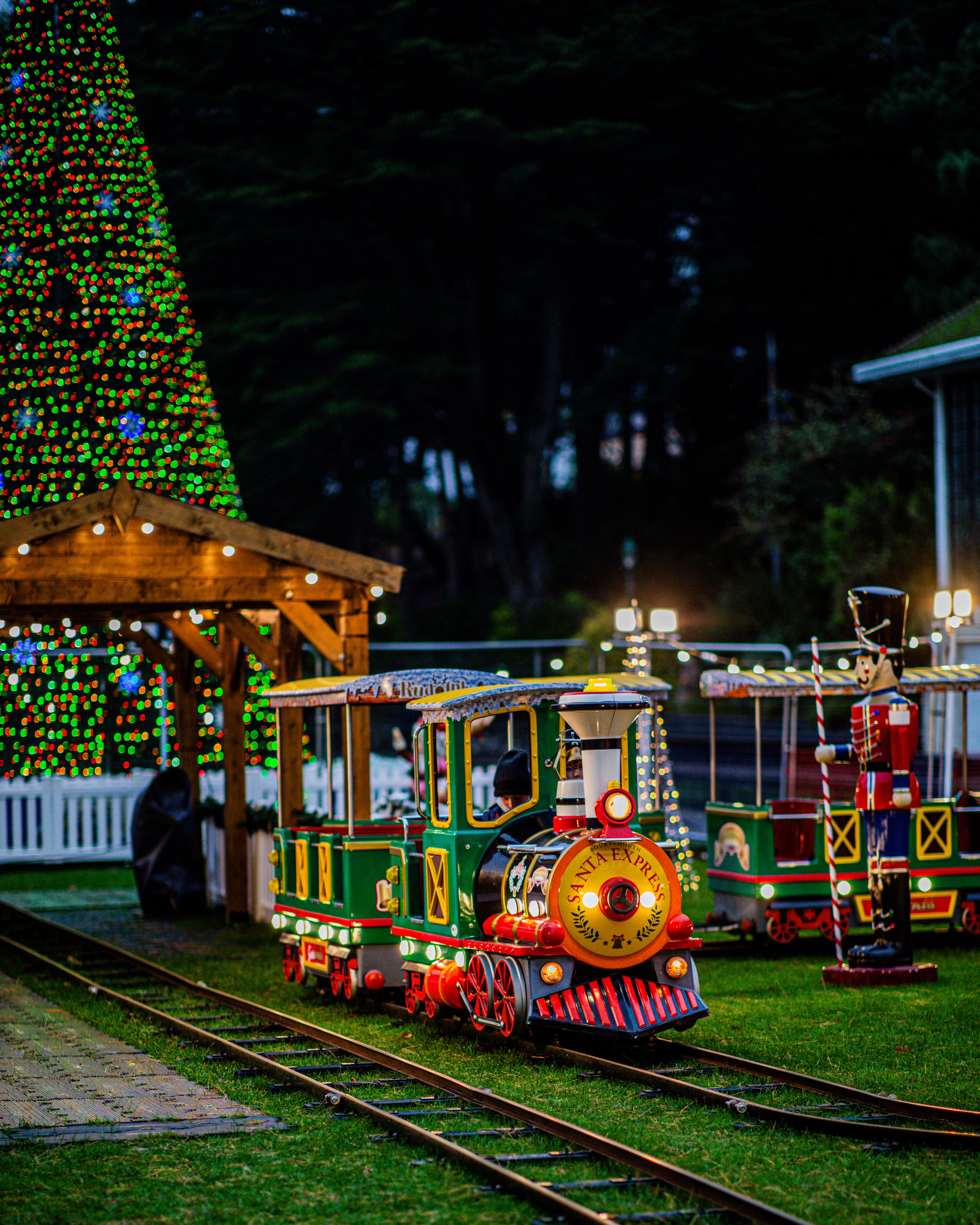 Festive Miniature Holiday Train Ride at Night · Free Stock Photo