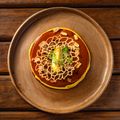 Plated Mexican dish in mole sauce, photo by Leonardo Aquino on Pexels