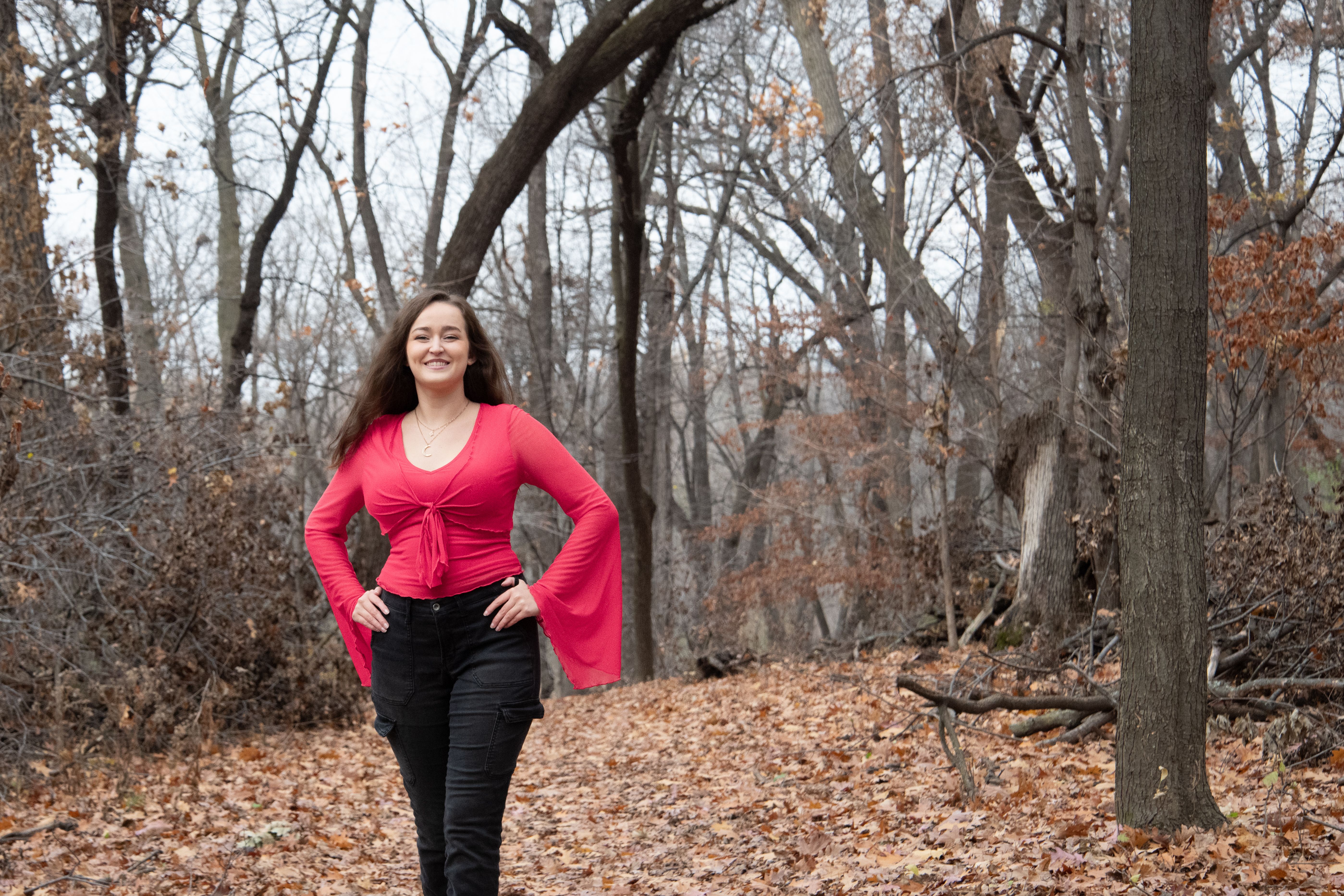 Woman Strolling in Autumn Forest Pathway · Free Stock Photo