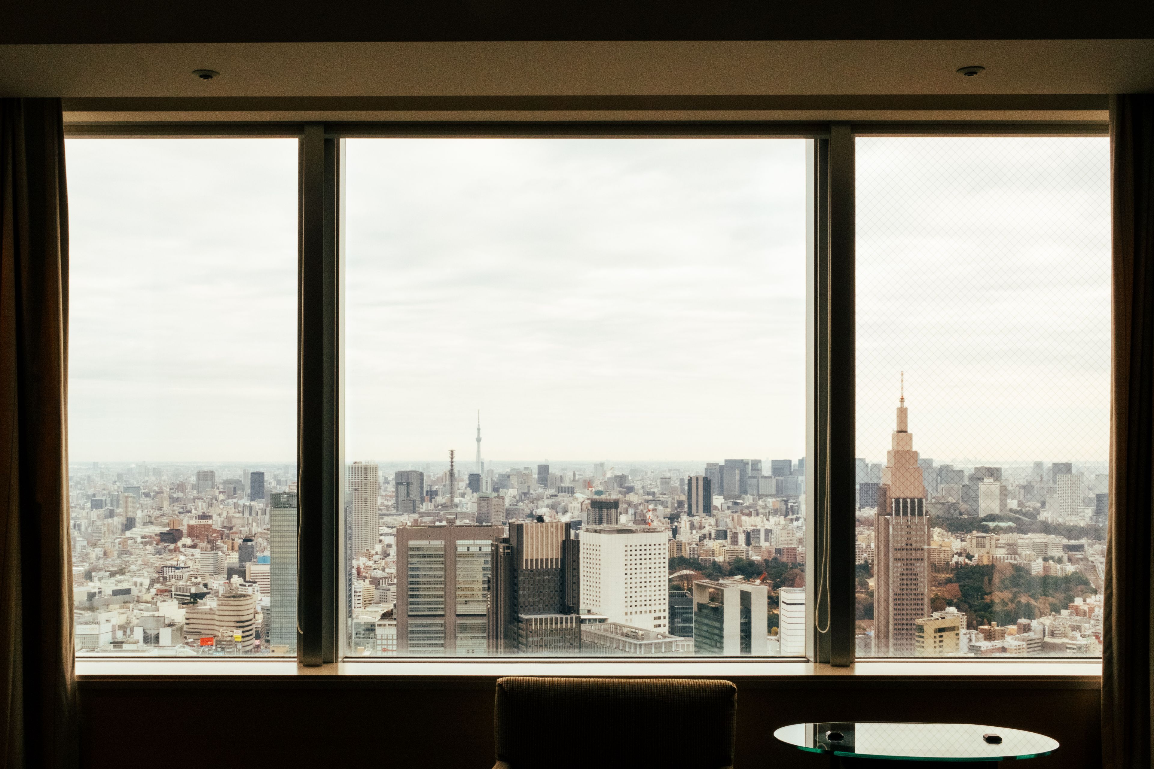 Imperial Palace gardens and Tokyo skyline from a luxury hotel window in Otemachi