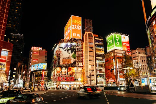Bright cityscape of Shinjuku, Tokyo, showcasing vibrant neon lights and bustling streets.