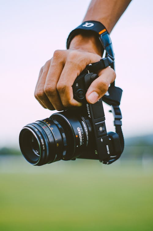 Free Person Holding A Camera Stock Photo