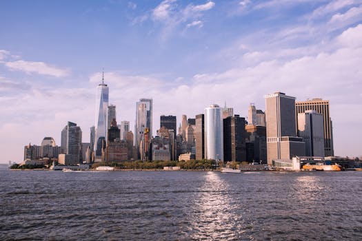 Scenic view of Manhattan skyline and Hudson River with clear sky.