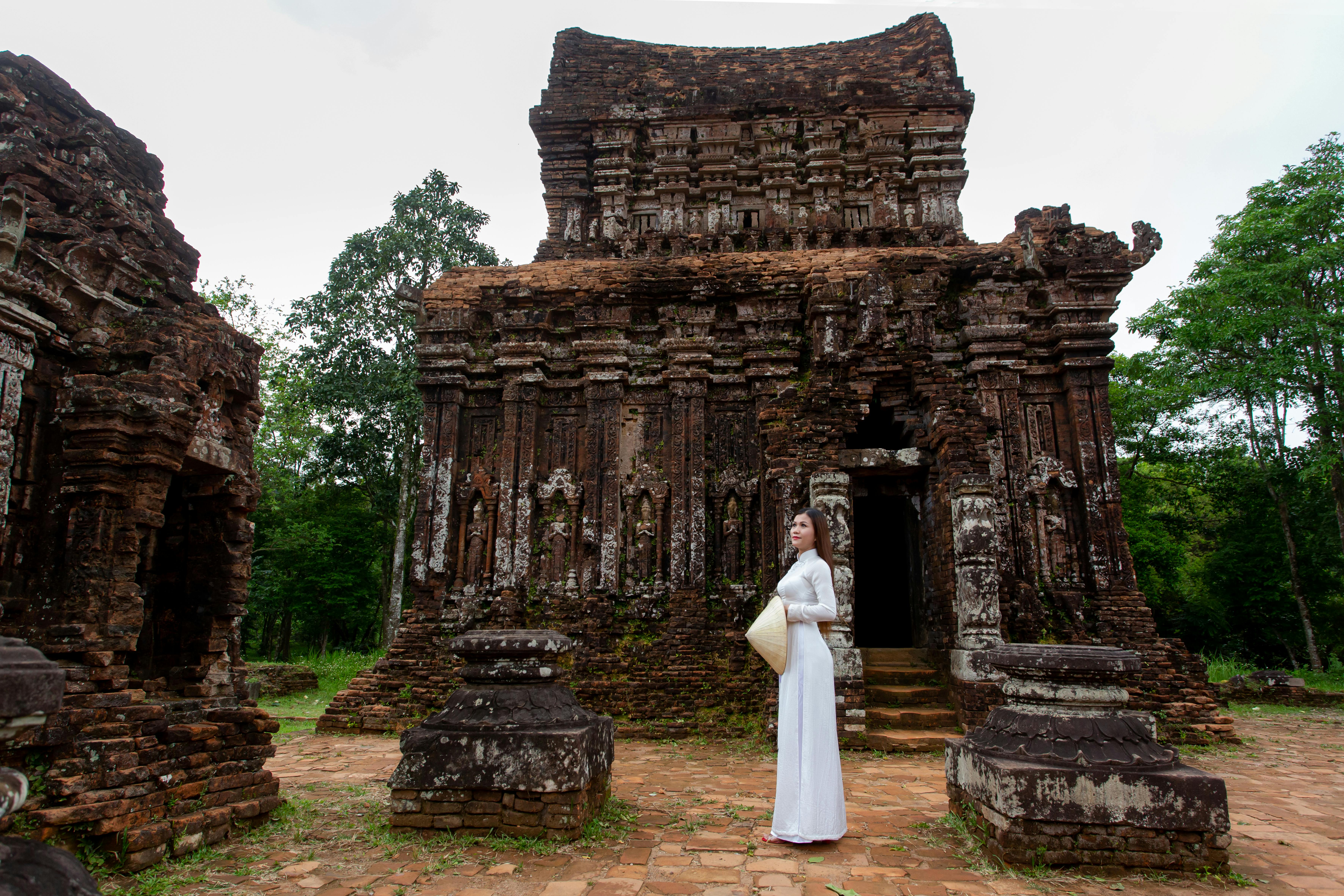 Free Woman in traditional Vietnamese dress at My Son Sanctuary, Quang Nam. Stock Photo