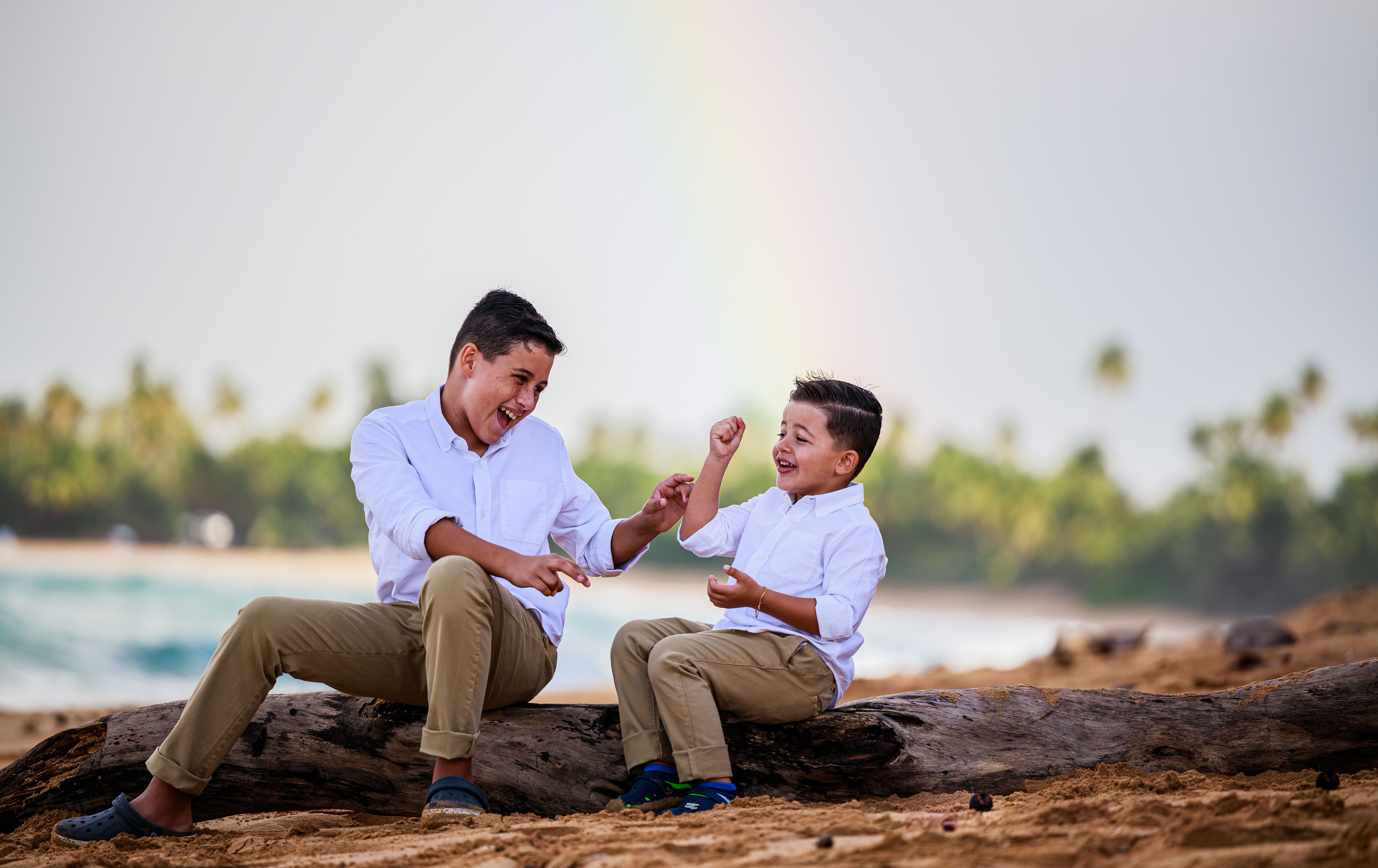 An older brother and his younger brother by the water