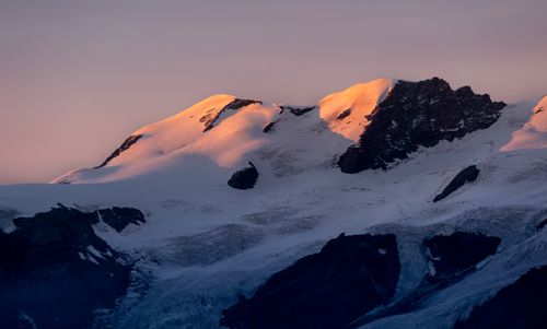 Free Captivating view of snow-covered mountains in Staffal, Italy at sunset. Stock Photo